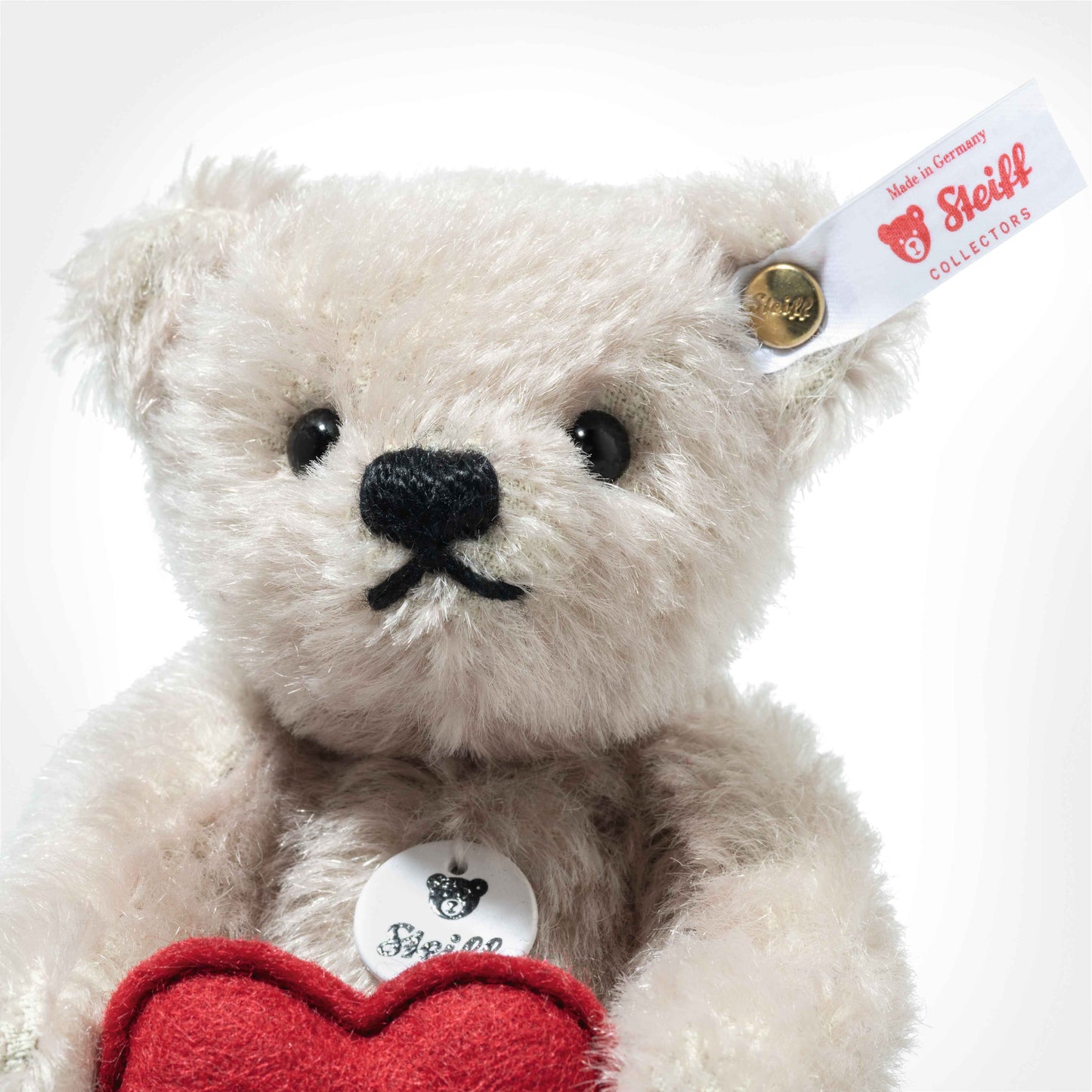 Steiff Teddybär mit Herz 13cm RMS silber